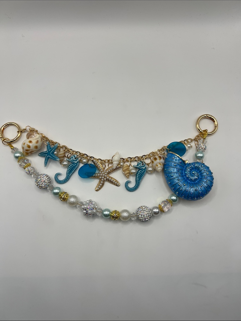 561. Blue Nautical Charm Bag Chain with Seashells 9 1/2”